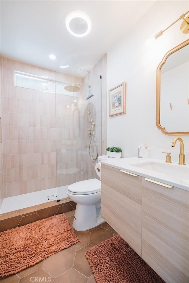 58250 Sierra Vista Dr, Yucca Valley, CA 92284 - bathroom featuring vanity, toilet, tile patterned flooring, and a walk in shower