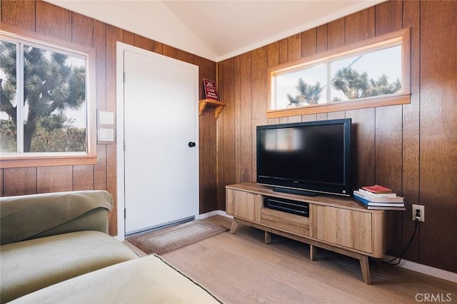 58250 Sierra Vista Dr, Yucca Valley, CA 92284 - living room with light wood-style flooring, vaulted ceiling, healthy amount of natural light, and wooden walls