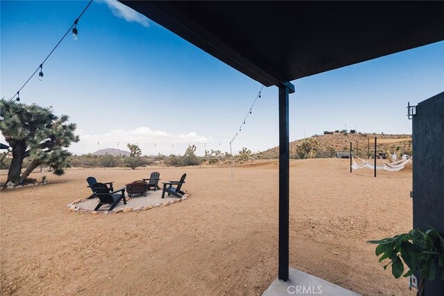 58250 Sierra Vista Dr, Yucca Valley, CA 92284 - view of yard with a fire pit