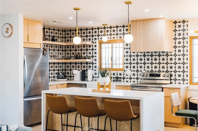 58250 Sierra Vista Dr, Yucca Valley, CA 92284 - kitchen featuring appliances with stainless steel finishes, open shelves, light countertops, light brown cabinetry, and decorative backsplash