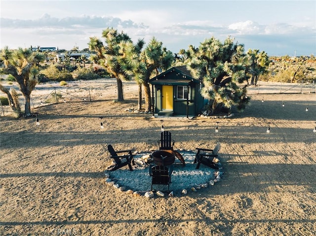 58250 Sierra Vista Dr, Yucca Valley, CA 92284 - view of front of house with an outdoor fire pit