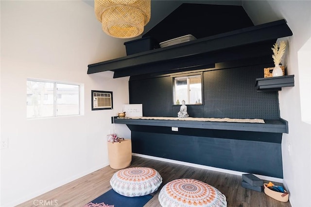 58250 Sierra Vista Dr, Yucca Valley, CA 92284 - detailed view of wood finished floors, baseboards, and a wall mounted air conditioner