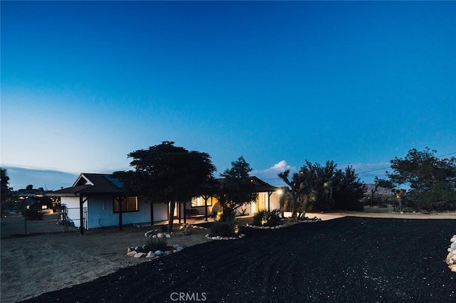 58250 Sierra Vista Dr, Yucca Valley, CA 92284 - view of front facade with a porch and stucco siding