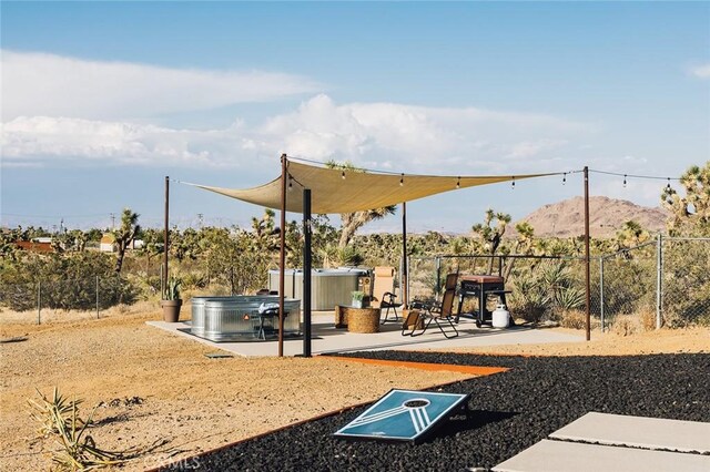 58250 Sierra Vista Dr, Yucca Valley, CA 92284 - view of jungle gym featuring a mountain view and a patio area