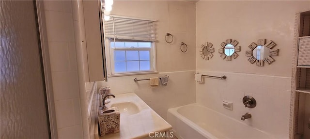 1623 S Sycamore Ave, Los Angeles, CA 90019 - bathroom featuring tile walls, a bath, and vanity