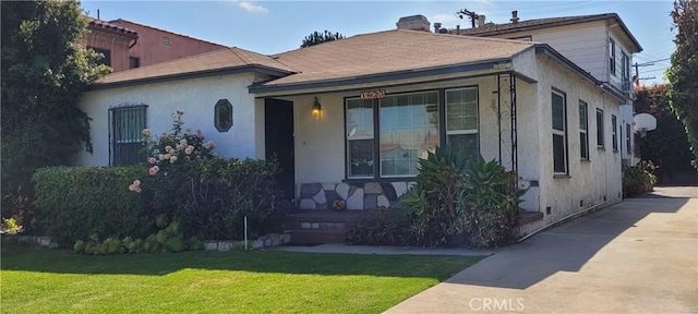 1623 S Sycamore Ave, Los Angeles, CA 90019 - bungalow with a front lawn, a porch, and stucco siding