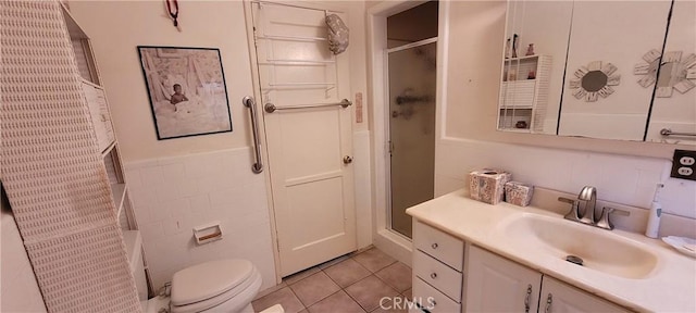 1623 S Sycamore Ave, Los Angeles, CA 90019 - full bathroom with an enclosed shower, vanity, tile patterned floors, tile walls, and wainscoting