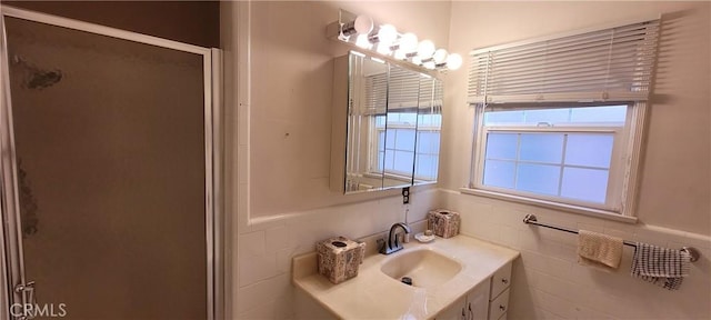 1623 S Sycamore Ave, Los Angeles, CA 90019 - full bath featuring a stall shower, vanity, and tile walls