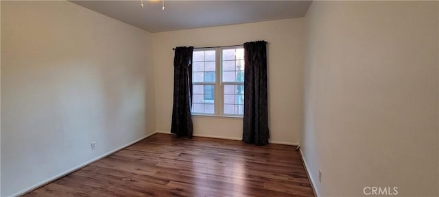 1623 S Sycamore Ave, Los Angeles, CA 90019 - spare room featuring healthy amount of natural light and wood finished floors