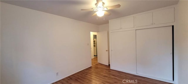 1623 S Sycamore Ave, Los Angeles, CA 90019 - unfurnished bedroom featuring wood finished floors, a closet, and ceiling fan