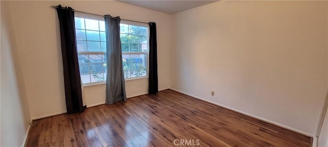 1623 S Sycamore Ave, Los Angeles, CA 90019 - empty room with wood finished floors and baseboards