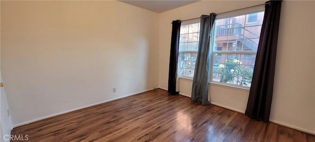1623 S Sycamore Ave, Los Angeles, CA 90019 - unfurnished room featuring wood finished floors and baseboards
