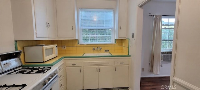 1623 S Sycamore Ave, Los Angeles, CA 90019 - kitchen featuring white appliances, tile countertops, white cabinets, backsplash, and wood finished floors