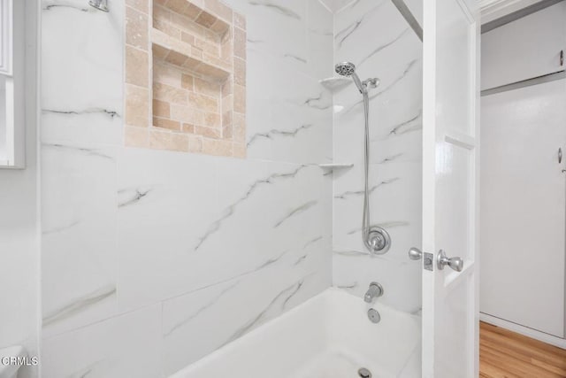  - full bathroom with bathtub / shower combination and wood finished floors