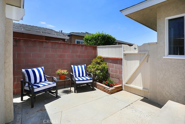 9864 Van Ruiten St, Bellflower, CA 90706 - view of patio featuring a gate