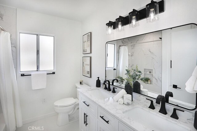9864 Van Ruiten St, Bellflower, CA 90706 - bathroom with double vanity and a shower with shower curtain