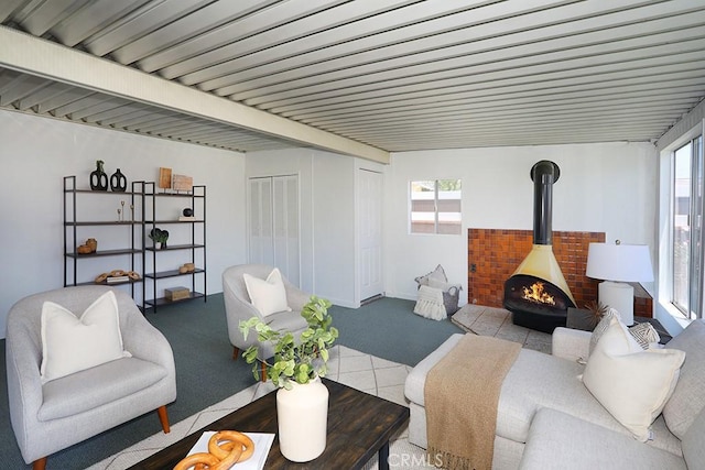 9864 Van Ruiten St, Bellflower, CA 90706 - living area with carpet floors and a wood stove