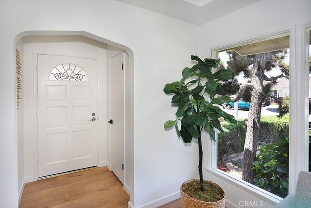 9864 Van Ruiten St, Bellflower, CA 90706 - entryway featuring arched walkways and wood finished floors