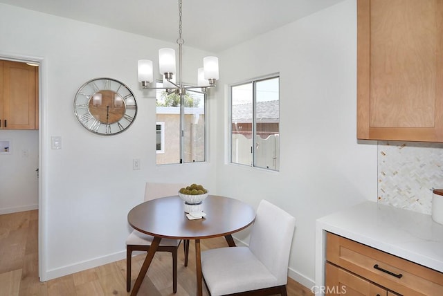 9864 Van Ruiten St, Bellflower, CA 90706 - dining space featuring a chandelier and light wood finished floors