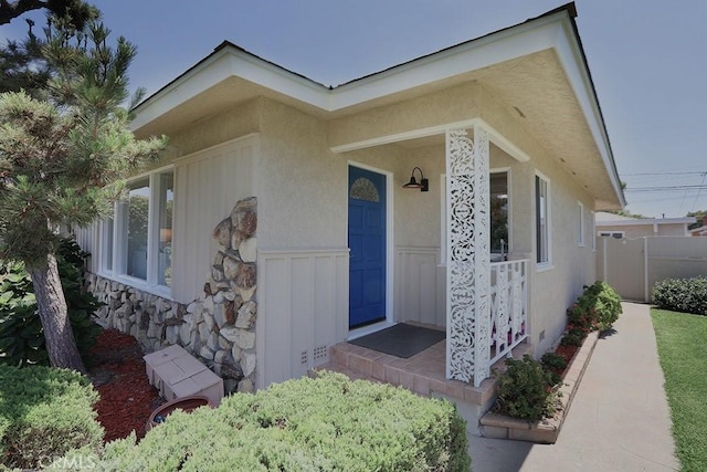 9864 Van Ruiten St, Bellflower, CA 90706 - doorway to property with stucco siding and stone siding