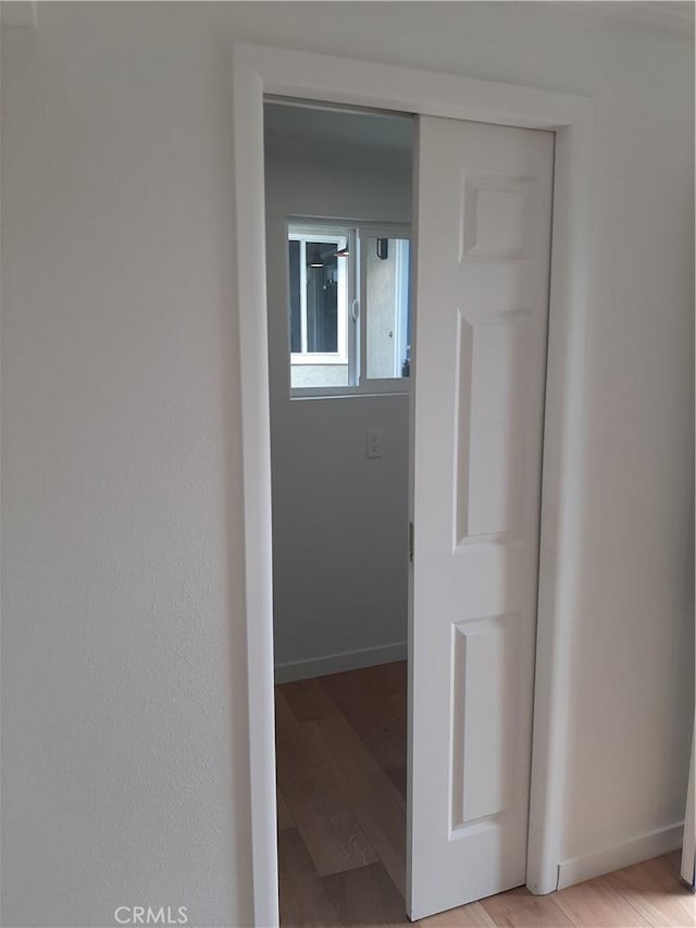 9864 Van Ruiten St, Bellflower, CA 90706 - hallway with light wood-type flooring and baseboards