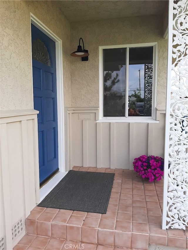 9864 Van Ruiten St, Bellflower, CA 90706 - property entrance with stucco siding and covered porch