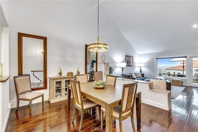 3 Nice Unit 25, Laguna Niguel, CA 92677 - dining space with high vaulted ceiling, a chandelier, dark wood finished floors, and baseboards