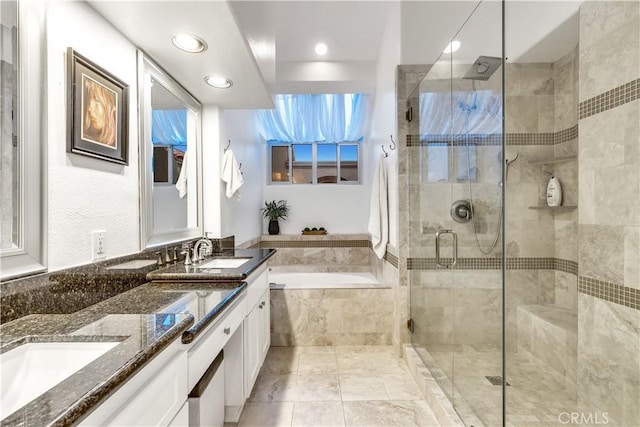 3 Nice Unit 25, Laguna Niguel, CA 92677 - bathroom featuring a garden tub, double vanity, a shower stall, and recessed lighting