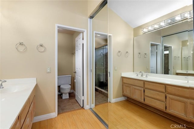 28462 La Alcala, Laguna Niguel, CA 92677 - full bath with double vanity, wood finished floors, lofted ceiling, and a shower with shower door