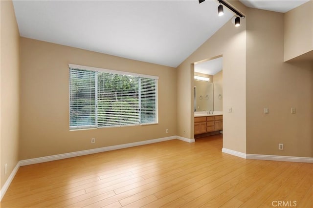28462 La Alcala, Laguna Niguel, CA 92677 - spare room with vaulted ceiling and light wood-type flooring