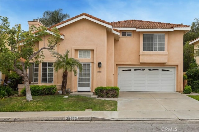 28462 La Alcala, Laguna Niguel, CA 92677 - view of front of house with an attached garage, driveway, stucco siding, a front yard, and a tile roof