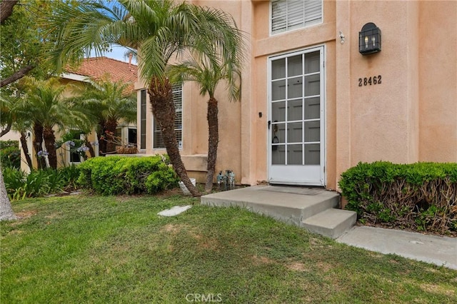 28462 La Alcala, Laguna Niguel, CA 92677 - entrance to property featuring stucco siding and a lawn