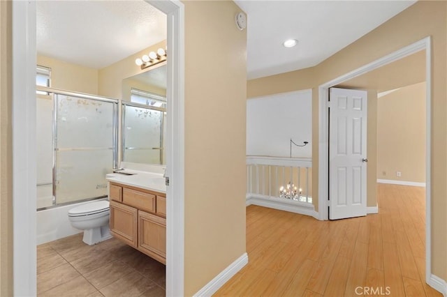 28462 La Alcala, Laguna Niguel, CA 92677 - bathroom with vanity, bath / shower combo with glass door, and wood finished floors