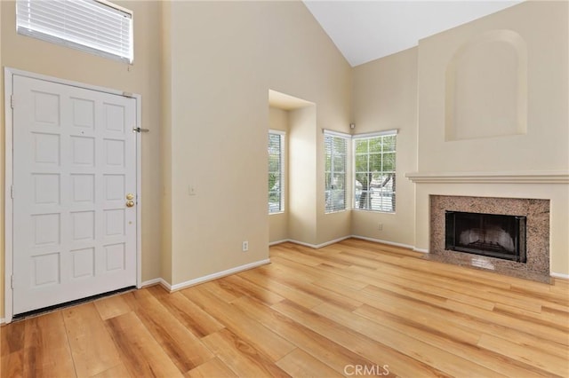 28462 La Alcala, Laguna Niguel, CA 92677 - foyer featuring wood finished floors, high vaulted ceiling, and a fireplace with flush hearth