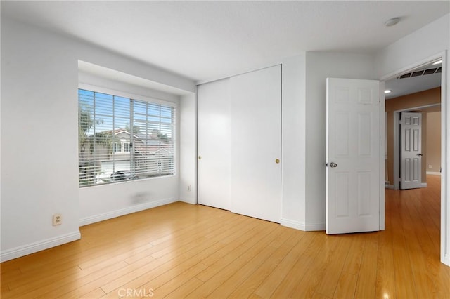 28462 La Alcala, Laguna Niguel, CA 92677 - unfurnished bedroom with light wood finished floors and a closet