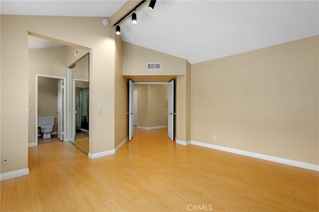 28462 La Alcala, Laguna Niguel, CA 92677 - spare room featuring light wood-style floors, high vaulted ceiling, and beam ceiling