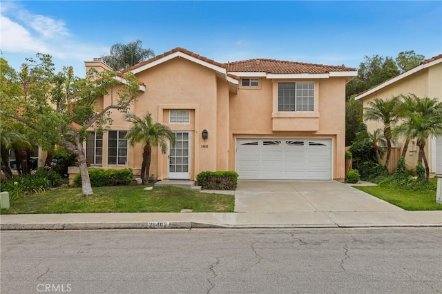 28462 La Alcala, Laguna Niguel, CA 92677 - view of front facade featuring stucco siding, a garage, driveway, a front lawn, and a tile roof