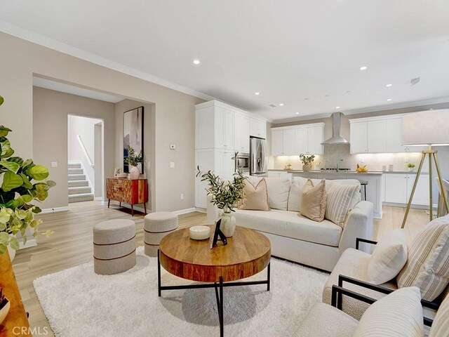 159 Frazier, Irvine, CA 92620 - living room featuring light wood-style floors, recessed lighting, and stairway