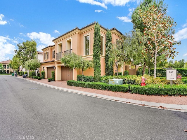 159 Frazier, Irvine, CA 92620 - view of building exterior featuring an attached garage and driveway