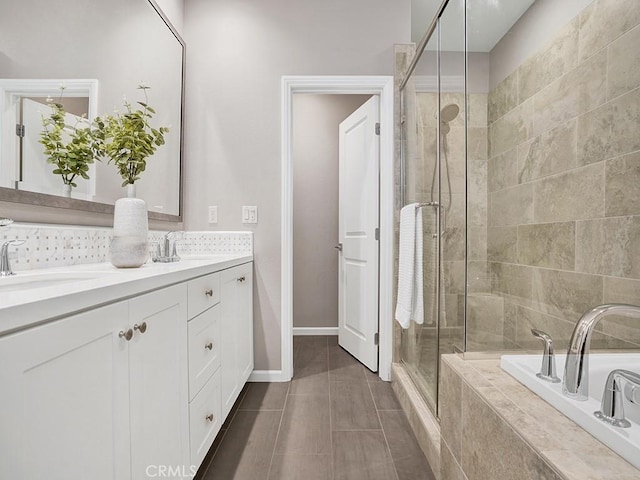 159 Frazier, Irvine, CA 92620 - full bath featuring a shower stall, a garden tub, double vanity, tile patterned flooring, and baseboards