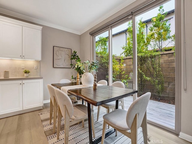 159 Frazier, Irvine, CA 92620 - dining area featuring light wood-style flooring, crown molding, and baseboards
