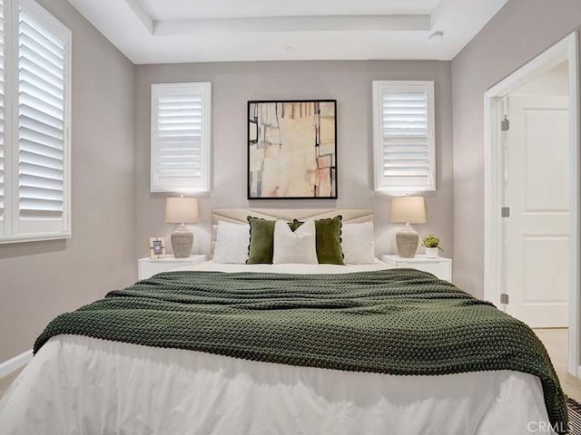 159 Frazier, Irvine, CA 92620 - bedroom with a tray ceiling, multiple windows, and baseboards