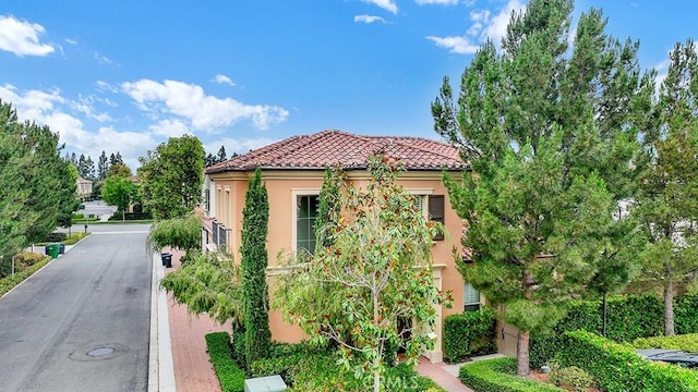 159 Frazier, Irvine, CA 92620 - view of front of home featuring stucco siding and a tiled roof