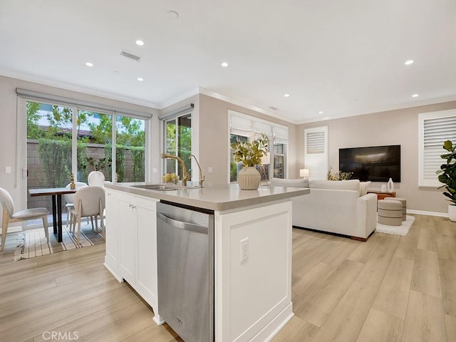 159 Frazier, Irvine, CA 92620 - kitchen with stainless steel dishwasher, light wood-type flooring, white cabinets, ornamental molding, and a kitchen island with sink
