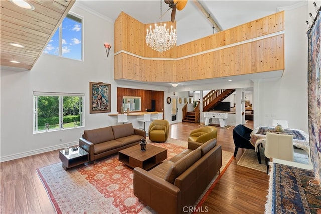 1377 Knoll Rd, Redlands, CA 92373 - living room with a high ceiling, stairway, a chandelier, wood finished floors, and recessed lighting