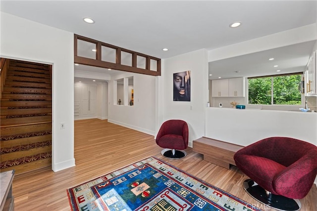 1377 Knoll Rd, Redlands, CA 92373 - sitting room featuring stairs, light wood-style floors, and recessed lighting