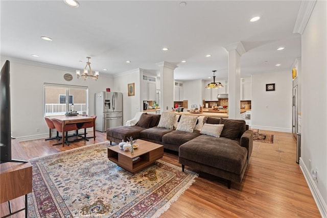 1377 Knoll Rd, Redlands, CA 92373 - living area featuring decorative columns, a chandelier, recessed lighting, light wood-type flooring, and ornamental molding