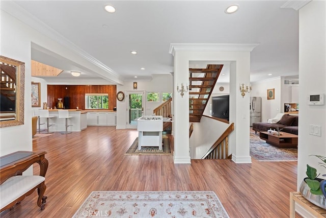 1377 Knoll Rd, Redlands, CA 92373 - staircase with crown molding, recessed lighting, and wood finished floors