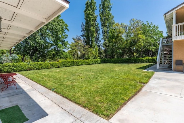 1377 Knoll Rd, Redlands, CA 92373 - view of grassy yard with stairway and a patio