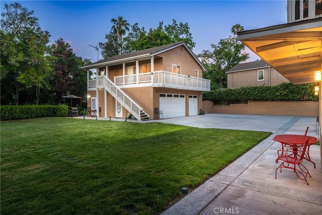1377 Knoll Rd, Redlands, CA 92373 - view of front facade featuring stairs, a front yard, stucco siding, and driveway